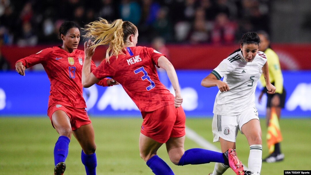 Mexico defender Jimena Lopez (5) passes the ball while U.S. midfielder Samantha Mewis (3) defends during the second half of the CONCACAF Women's Olympic Qualifying soccer tournament, Feb. 7, 2020, at Dignity Health Sports Park, Los Angeles, Calif.
