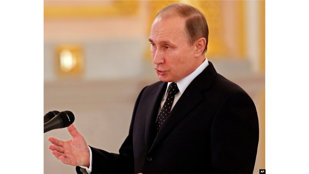 Russian President addresses newly arrived foreign ambassadors of 15 countries during receiving credentials ceremony in Moscow's Kremlin, Russia, Nov. 26, 2015.