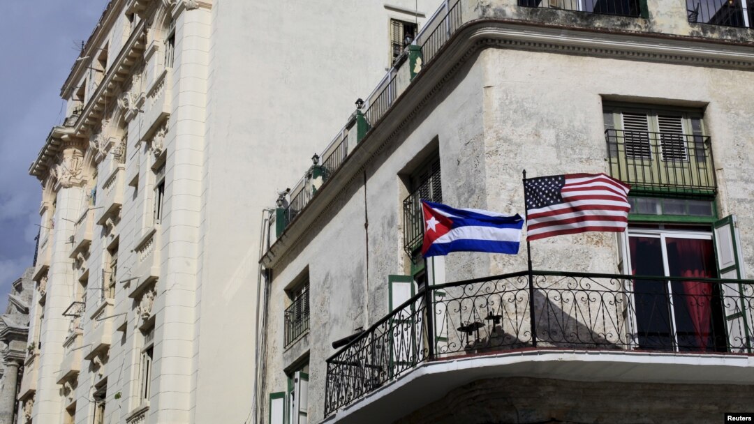Cuban and U.S. flags are seen on the balcony of a restaurant in Havana, Cuba, March 19, 2016. 