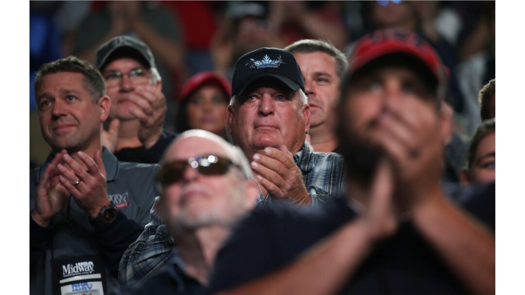 FILE - Members applaud as U.S. President Donald Trump addresses the National Rifle Association's (NRA) 148th annual meeting in Indianapolis, Indiana, April 26, 2019.
