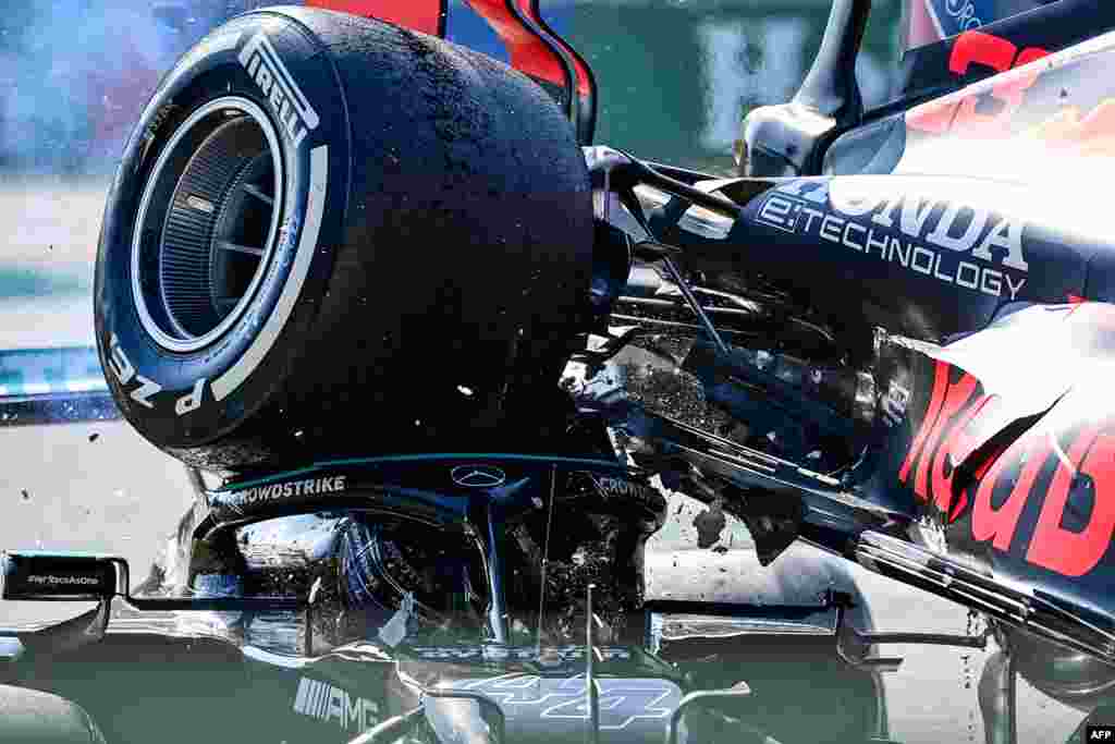 Mercedes' British driver Lewis Hamilton (L) and Red Bull's Dutch driver Max Verstappen collide during the Italian Formula One Grand Prix at the Autodromo Nazionale circuit in Monza.