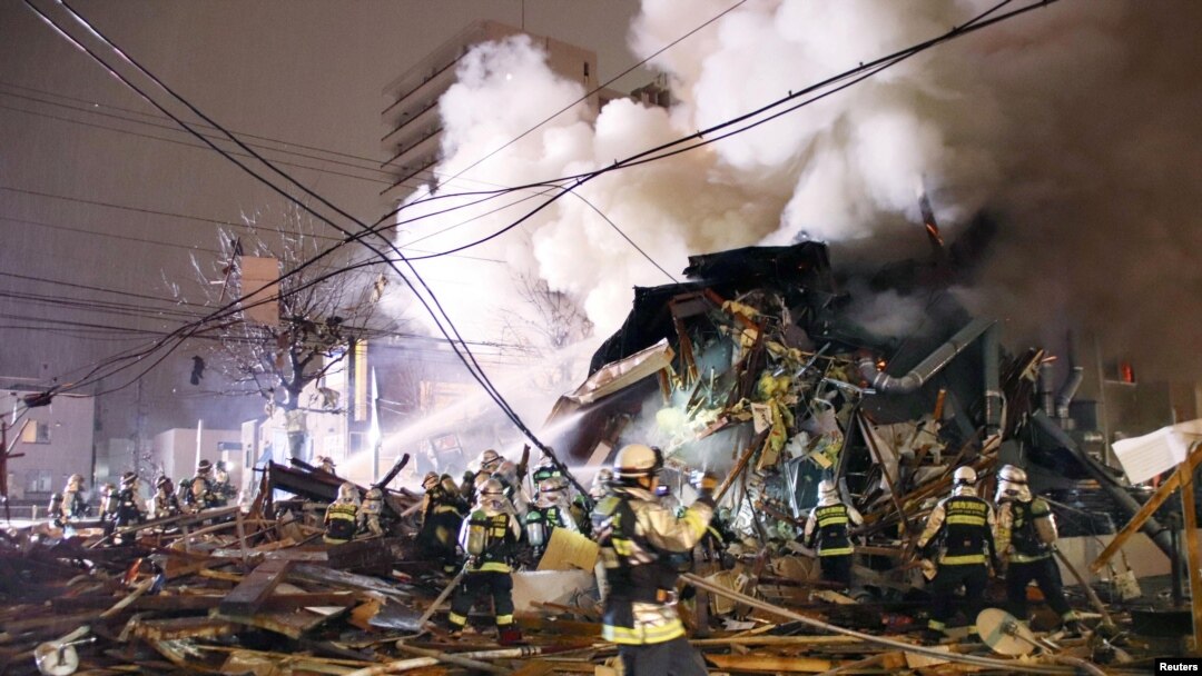 Firefighters operate at the site where a large explosion occurred at a restaurant in Sapporo, Hokkaido, northern Japan, in this photo taken by Kyodo, Dec. 16, 2018. 