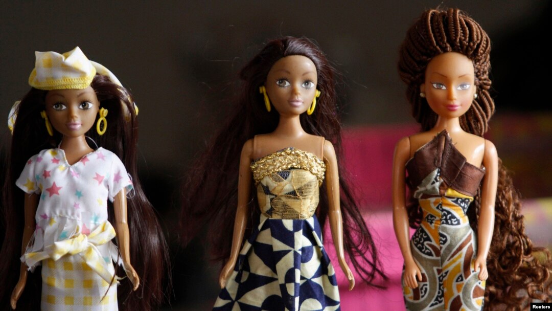 Dolls dressed in local attire are arranged on a table at a workshop in Surulere district, in Nigeria's commercial capital Lagos, Jan. 8, 2014. 