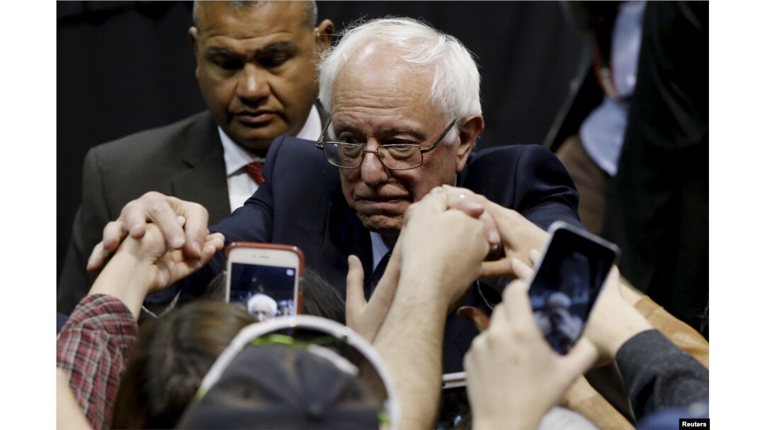 Democratic U.S. presidential candidate Bernie Sanders shakes hands with supporters during a campaign rally at Missouri State University in Springfield, Mo., March 12, 2016.