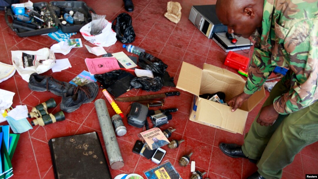 Hand grenades and other items are displayed by police after an early morning raid at a mosque in the coastal town of Mombasa, Nov. 17, 2014. 