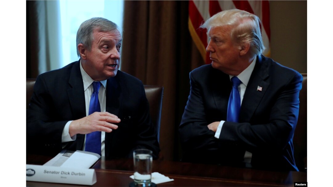 FILE - U.S. President Donald Trump listens to U.S. Senator Dick Durbin, D-Ill., during a meeting with legislators on immigration reform at the White House in Washington, Jan. 9, 2018.