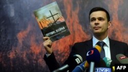 FILE - Russia's opposition activist Ilya Yashin attends the presentation of an independent expert report entitled "Putin. War" in Moscow, May 12, 2015. 