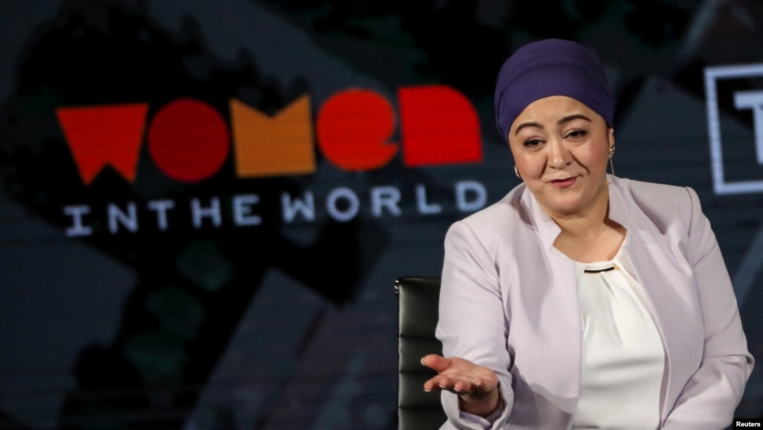 FILE - Gulchehra Hoja, a Uyghur journalist who then worked for Radio Free Asia, speaks on stage at the Women in the World Summit in New York, April 11, 2019.