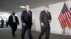 FILE - Senate Republican Majority Leader Mitch McConnell, left, and Republican Sen. Lindsey Graham, both wearing face masks to protect against the coronavirus walk on Capitol Hill, in Washington, May 19, 2020. 