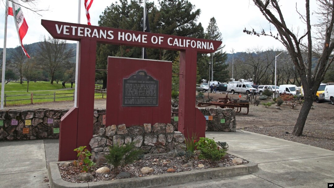 Media trucks set up at the entrance to the Veterans Home of California in Yountville, California, March 9, 2018.