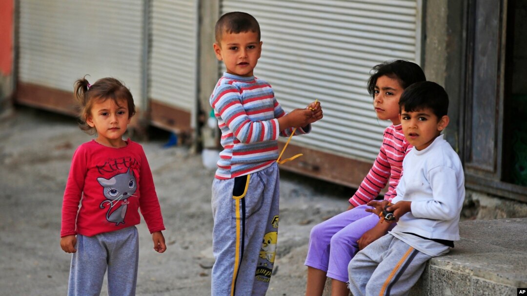 FILE - Syrian refugee children pass time in a neighborhood of the city of Gaziantep, southeastern Turkey on May 16, 2016. (AP)