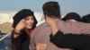 Women flee Islamic State territory fully veiled but many quickly remove the veils, revealing their faces in public for the first time in two and a half years in Khazir, Kurdish Iraq on Dec. 7, 2016. (Photo: H.Murdock / VOA)