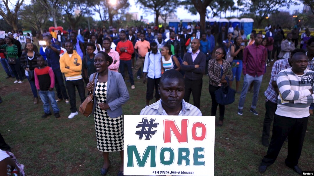 People sing as they attend a memorial concert at the "Freedom Corner" in Kenya's capital Nairobi, April 14, 2015, in memory of the Garissa university students who were killed by gunmen.
