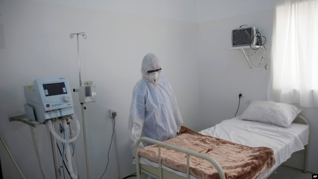 A medical staff member works on setting up an isolation room at a coronavirus quarantine ward at a hospital in Sanaa, Yemen, March 15, 2020. 