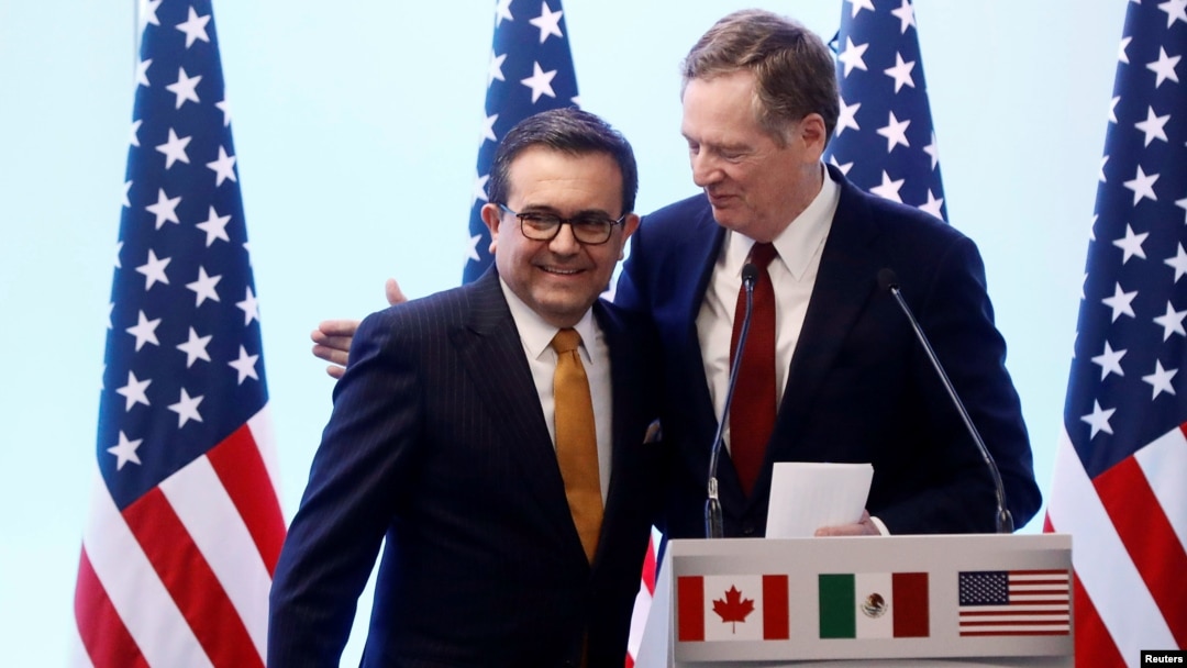 FILE - U.S. Trade Representative Robert Lighthizer embraces Mexican Economy Minister Ildefonso Guajardo during a joint news conference on the closing of the seventh round of NAFTA talks in Mexico City, March 5, 2018.