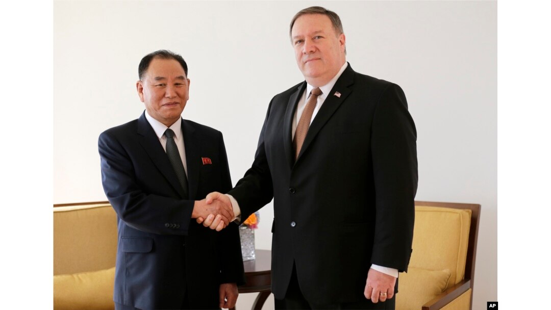 Kim Yong Chol, left, former North Korean military intelligence chief and one of leader Kim Jong Un's closest aides, shakes hands with U.S. Secretary of State Mike Pompeo during a meeting, May 31, 2018, in New York.