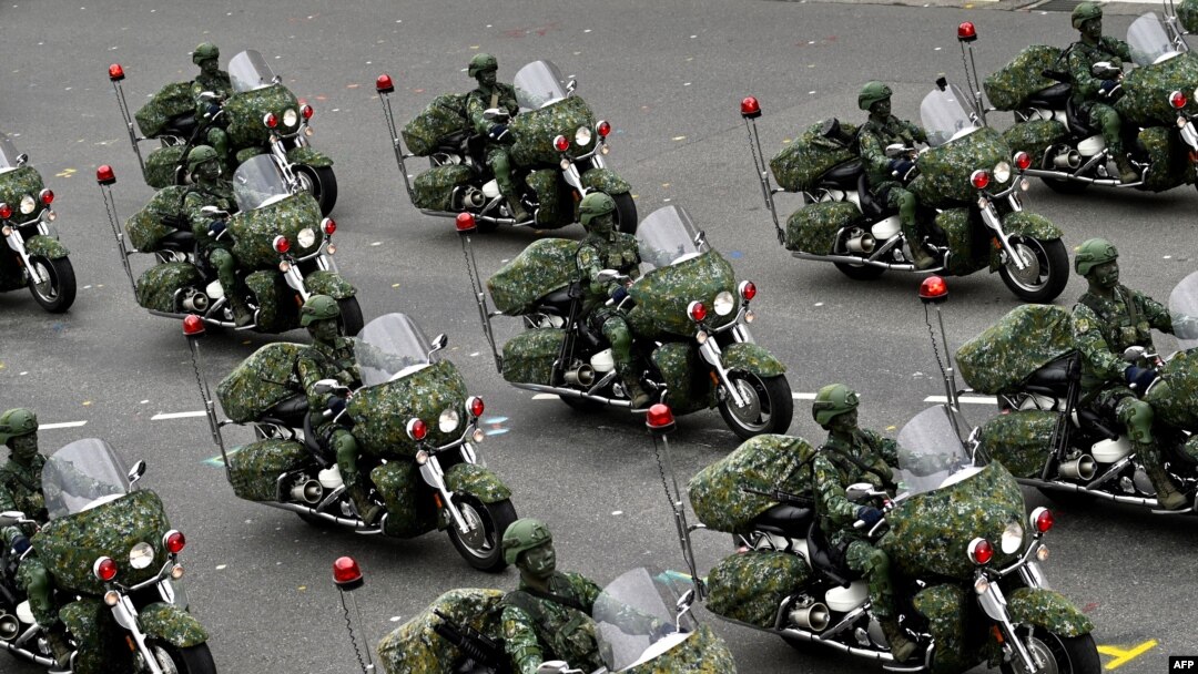 Taiwan’s military police perform during the National Day in front of the Presidential Office in Taipei on Oct. 10, 2020.