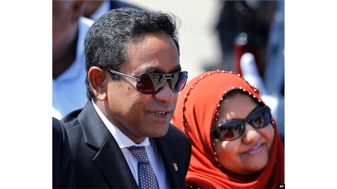 FILE - Maldives President Yameen Abdul Gayoom, accompanied by his wife Fathimath Ibrahim, arrives in Colombo, Sri Lanka, July 22, 2015.