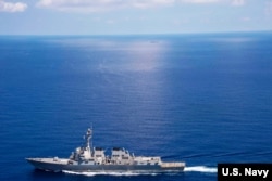 USS Lassen (DDG 82) operates in international waters near the Chinese People's Liberation Army (Navy) Jianghu V-class frigate Dongguan (560) while on patrol in U.S. 7th Fleet at South China Sea, Sep 29, 2015.