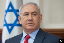 Israeli Prime Minister Benjamin Netanyahu attends the weekly cabinet meeting at his office in Jerusalem, Sunday, Oct. 1, 2017.