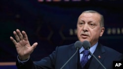 Turkey's President Recep Tayyip Erdogan speaks at a ceremony for judicial appointments in Ankara, March 19, 2018.