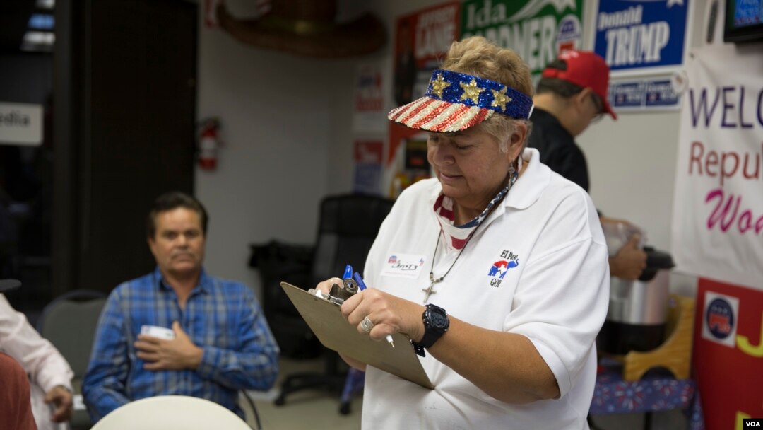 At the GOP headquarters in El Paso, Texas, a volunteer signs people in moments before U.S. Sen. Ted Cruz, R-Texas, narrowly defeated Democratic challenger Beto O'Rourke Tuesday, Nov. 6, 2018.