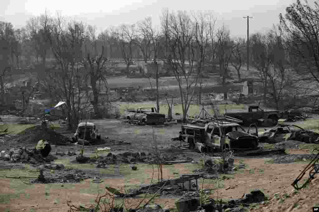 Cars are burnt in the Carr Fire in a neighborhood in Redding, California, Aug. 11, 2018.