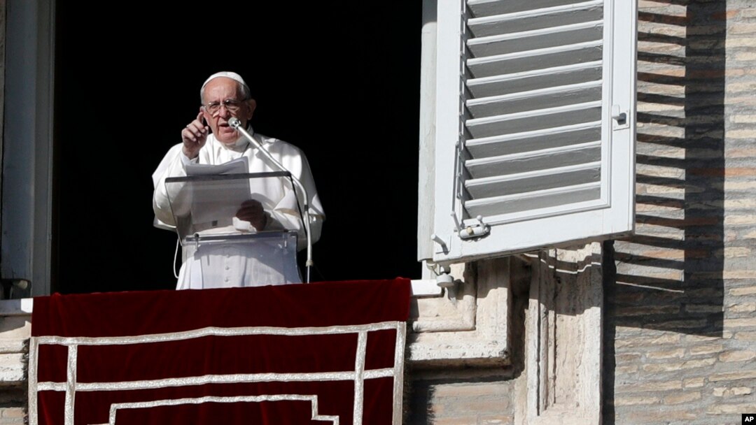 Pope Francis gestures during the Angelus noon prayer in St. Peter's Square at the Vatican, Dec. 17, 2017. 