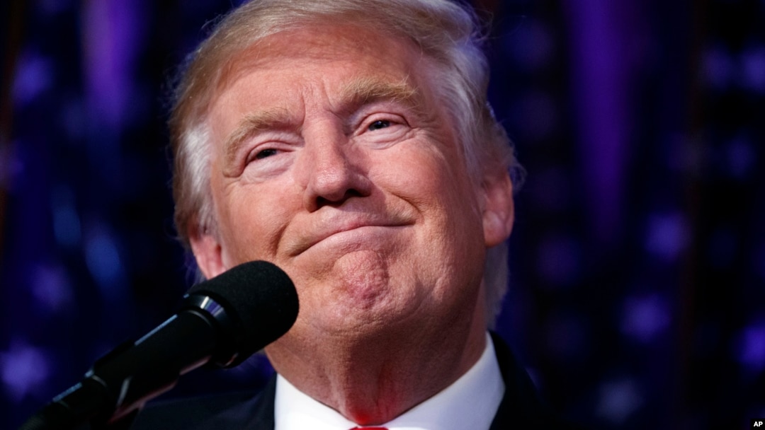 President-elect Donald Trump smiles as he arrives to speak at an election night rally, Wednesday, Nov. 9, 2016, in New York. 