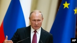 Russian President Vladimir Putin speaks during a news conference in Helsinki, Finland, Aug. 21, 2019. 