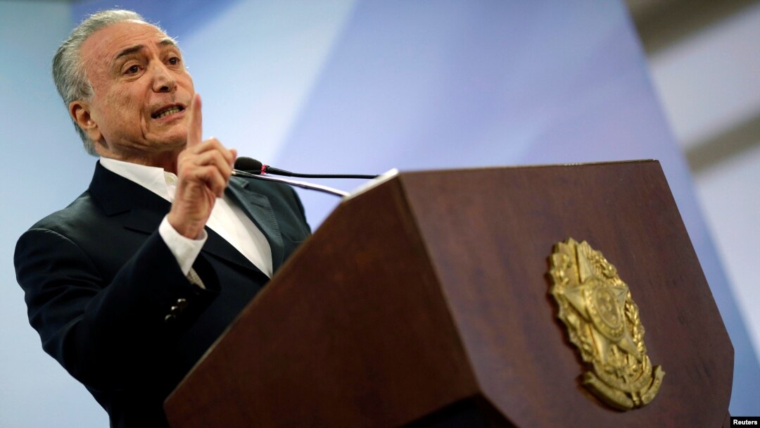 FILE - Brazil's President Michel Temer speaks at Planalto Palace in Brasilia, Brazil, May 20, 2017. 
