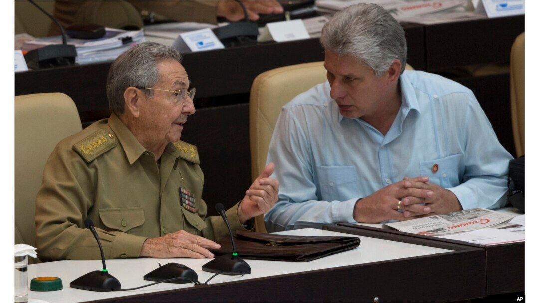 Cuba's President Raul Castro, left, talks with Vice President Miguel Diaz Canel during the opening of the National Assembly session in Havana, Cuba, Friday, July 8, 2016.