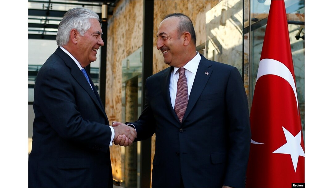FILE - U.S. Secretary of State Rex Tillerson, left, meets with Turkish Foreign Minister Mevlut Cavusoglu in Istanbul, Turkey, July 9, 2017.