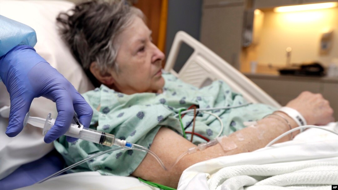 A nurse administers antibiotics to Alice McDonald at ProMedica Toledo Hospital in Toledo, Ohio. A nasty flu season is hitting U.S. hospitals.