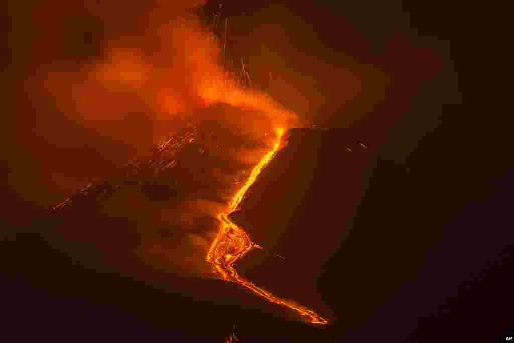 Lava flows from the Mt Etna volcano as seen from Milo, Sicily, Italy.