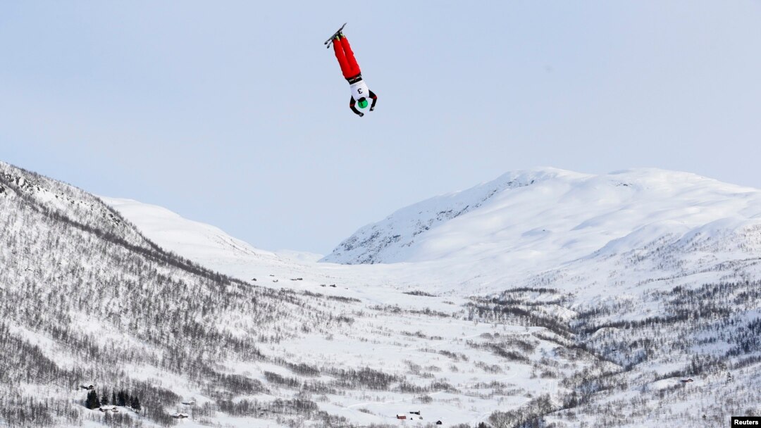 FILE - Qi Guangpu of China competes in the men's aerials race at the FIS Freestyle World Ski Championships in Voss, Norway, March 7, 2013. 