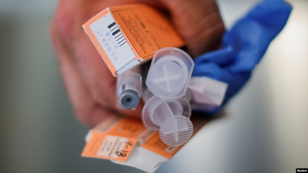 A Cataldo Ambulance medic holds used doses of naloxone after medics revived a man in his 40s who was found unresponsive from an opioid overdose in the Boston suburb of Salem, Massachusetts, Aug. 9, 2017. 