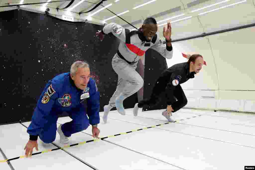Retired sprinter Usain Bolt, French astronaut Jean-Francois Clervoy, CEO of Novespace, and French Interior designer Octave de Gaulle who designed a bottle of "Mumm Grand Cordon Stellar" enjoy zero gravity conditions during a flight in a specially modified Airbus Zero-G plane above Reims, France,