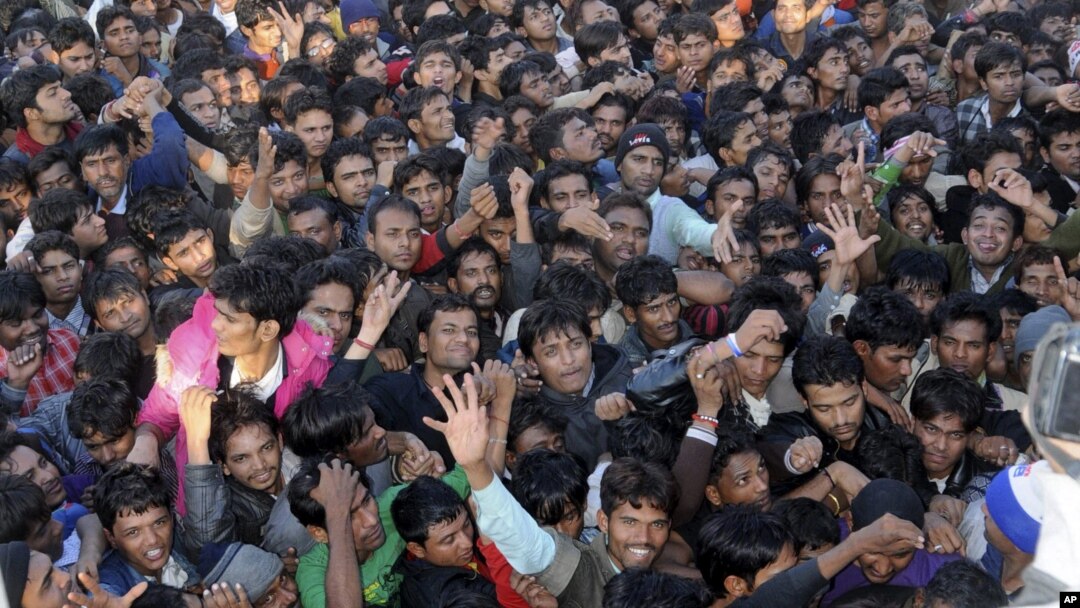 Indian cricket fans jostle for tickets for the second Twenty20 cricket match between India and Pakistan in Ahmadabad, India, December 26, 2012. 