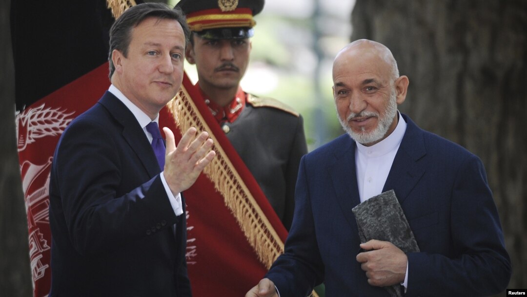 Britain's Prime Minister David Cameron (L) attends a news conference with Afghan President Hamid Karzai at the Presidential Palace in Kabul, Afghanistan, July 19, 2012.