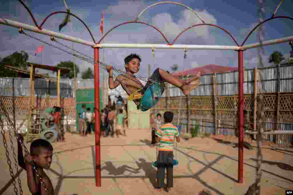 Rohingya refugee children play in a playground in the Thangkhali refugee camp near Cox's Bazar, Bangladesh, Aug. 9, 2018.