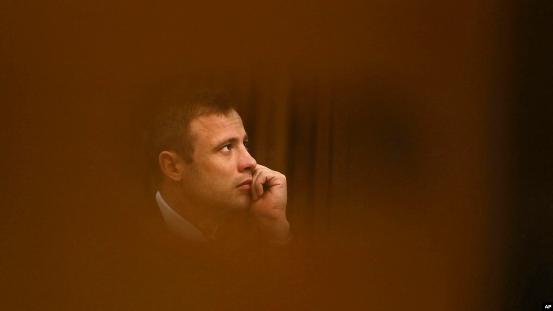 File - Oscar Pistorius sits in the high court for the fourth day of sentencing in Pretoria, South Africa, October 2014.