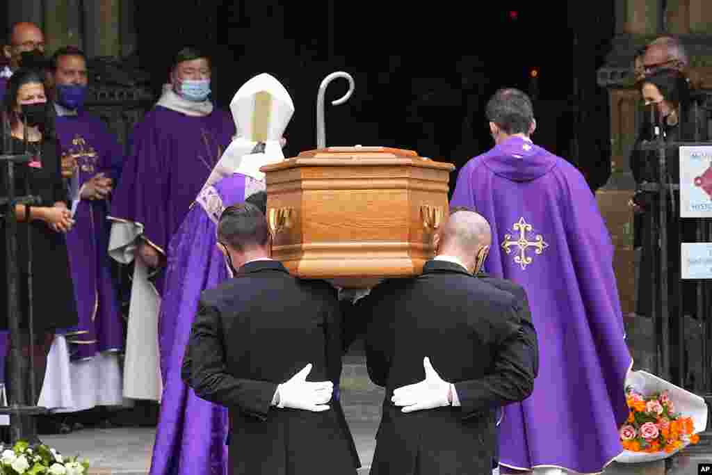 Pallbearers carry the coffin of actor Jean-Paul Belmondo at the Saint Germain des Près church, in Paris. The star of the iconic French New Wave film "Breathless" died Monday at age 88.