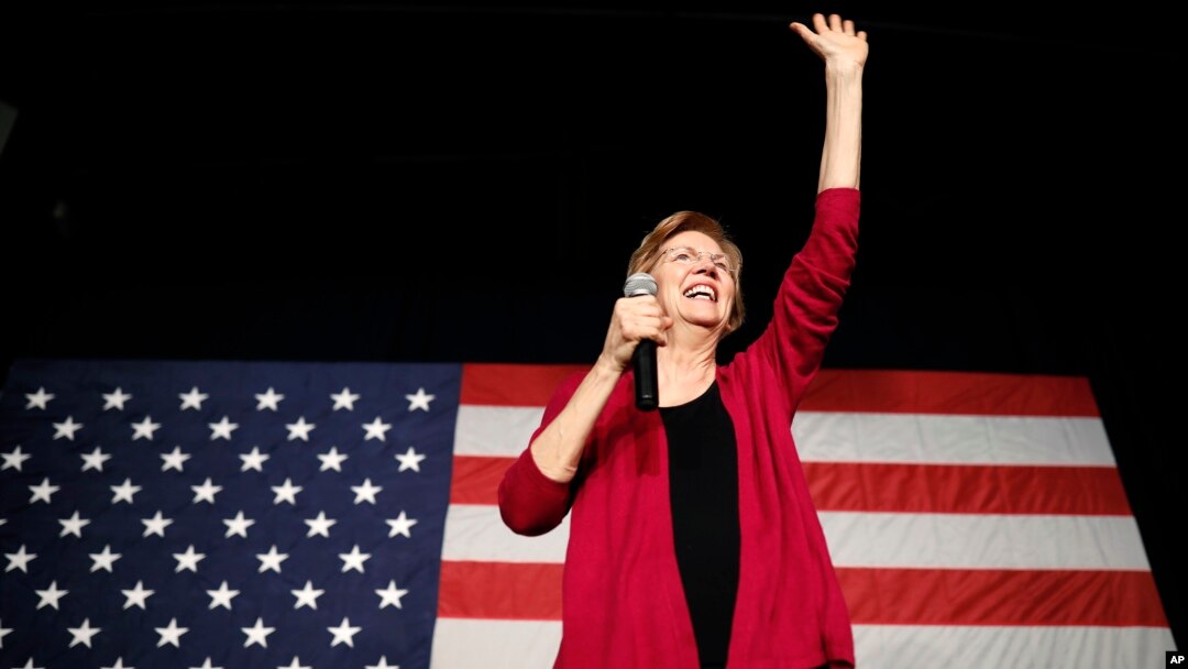 Sen. Elizabeth Warren, D-Mass, waves to the crowd during an organizing event at Curate event space in Des Moines, Iowa, Jan. 5, 2019.