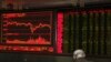 A Chinese man sits at a brokerage in Beijing, China, Dec. 25, 2018. Japanese stocks plunged Tuesday and other Asian markets declined following heavy Wall Street losses triggered by President Donald Trump's attack on the U.S. central bank. 