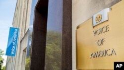 FILE - Signage is seen on the Voice of America building in Washington, June 15, 2020.