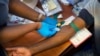 FILE - Blood is drawn from a clinical trials patient for the AstraZeneca test vaccine at the a hospital facility outside Johannesburg, South Africa, Nov. 30, 2020.