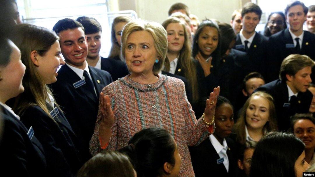 Democratic presidential candidate Hillary Clinton speaks with US Senate pages as she departs after meeting with Senate Democrats during their luncheon gathering at the U.S. Capitol in Washington, July 14, 2016. 