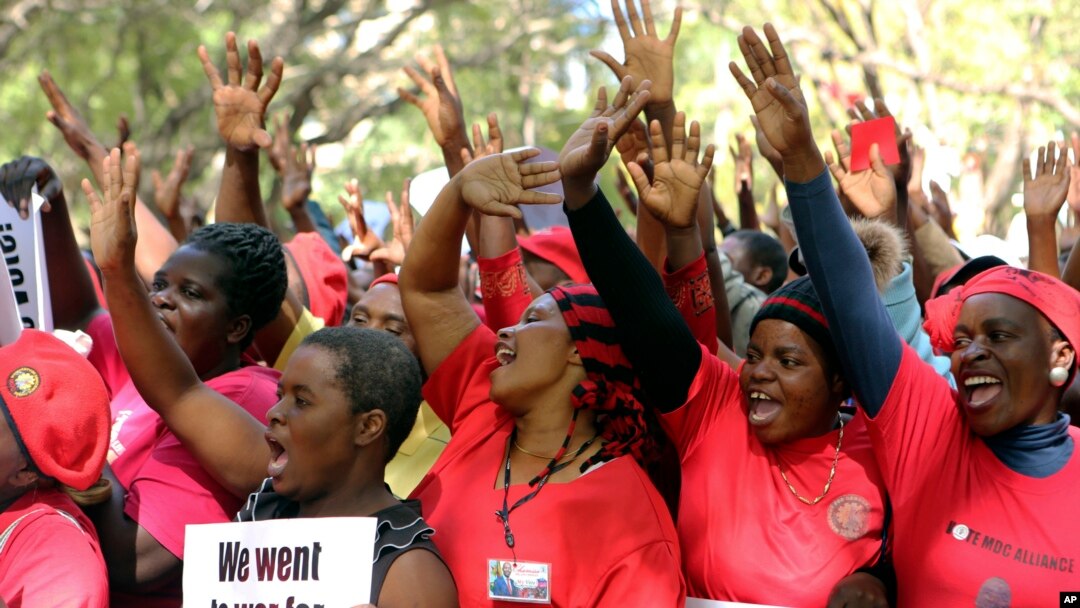 Opposition party supporters take part in a march for transparency on the streets of Harare, July 11, 2018.