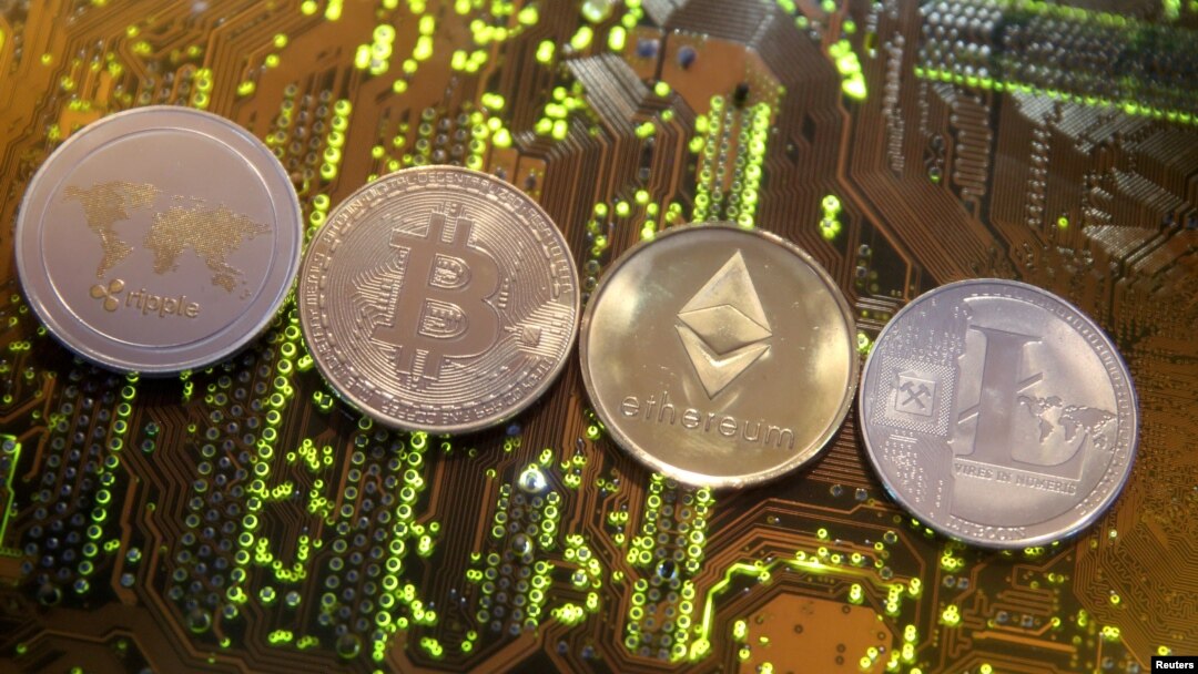 FILE - Representations of the Ripple, Bitcoin, Etherum and Litecoin virtual currencies, Feb. 13, 2018. 